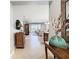 View through the entryway, showing a glimpse of the living room beyond at 15724 Aurora Lake Cir, Wimauma, FL 33598