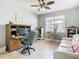 Bright home office features built-in desk and comfortable seating at 15724 Aurora Lake Cir, Wimauma, FL 33598