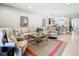 Open concept living room, kitchen view, and tile flooring throughout at 15724 Aurora Lake Cir, Wimauma, FL 33598