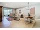 Open living space with light colored furniture and tile floors at 15724 Aurora Lake Cir, Wimauma, FL 33598