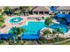 Large community pool with plenty of lounge chairs at 15724 Aurora Lake Cir, Wimauma, FL 33598