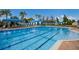 Resort-style pool with lap lanes and shaded seating at 15724 Aurora Lake Cir, Wimauma, FL 33598