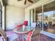 Relaxing screened patio with seating area and view of backyard at 15724 Aurora Lake Cir, Wimauma, FL 33598