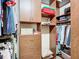 Large walk-in closet with custom shelving and hanging rods at 15724 Aurora Lake Cir, Wimauma, FL 33598