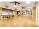 Bright yoga studio with hardwood floors and mirrors at 15724 Aurora Lake Cir, Wimauma, FL 33598