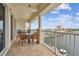Spacious balcony with outdoor furniture, offering stunning water views at 17717 Gulf Blvd # 601, Redington Shores, FL 33708