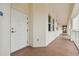 Clean hallway with white doors and neutral colored walls at 17717 Gulf Blvd # 601, Redington Shores, FL 33708