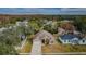 House and surrounding neighborhood from an aerial perspective at 1833 Hillcrest St, Tarpon Springs, FL 34689