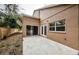 Spacious backyard patio with sliding glass doors and french doors leading to the interior at 1833 Hillcrest St, Tarpon Springs, FL 34689