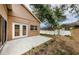 Backyard patio and view of the home's exterior at 1833 Hillcrest St, Tarpon Springs, FL 34689