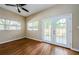 Spacious bedroom with hardwood floors and French doors at 1833 Hillcrest St, Tarpon Springs, FL 34689