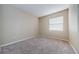 Bright bedroom with neutral walls and carpeting at 1833 Hillcrest St, Tarpon Springs, FL 34689