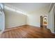 Spacious bedroom with hardwood floors and access to bathroom at 1833 Hillcrest St, Tarpon Springs, FL 34689