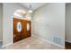 An entryway featuring double doors with glass inserts and a tiled floor at 1833 Hillcrest St, Tarpon Springs, FL 34689