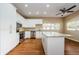 Modern kitchen with white cabinets, granite counters, and island at 1833 Hillcrest St, Tarpon Springs, FL 34689