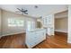 Modern kitchen with island, white cabinets, and access to patio at 1833 Hillcrest St, Tarpon Springs, FL 34689