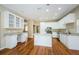 Updated kitchen featuring white cabinets and granite countertops at 1833 Hillcrest St, Tarpon Springs, FL 34689