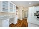 White kitchen cabinetry, granite counters, and built-in desk area at 1833 Hillcrest St, Tarpon Springs, FL 34689