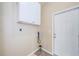 Laundry room with upper cabinets and exterior access at 1833 Hillcrest St, Tarpon Springs, FL 34689