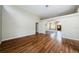 Bright living room with hardwood floors and views into adjacent rooms at 1833 Hillcrest St, Tarpon Springs, FL 34689