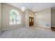 Spacious living room with hardwood and carpet flooring, high ceilings and lots of natural light at 1833 Hillcrest St, Tarpon Springs, FL 34689