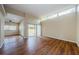 Living area with hardwood floors, sliding doors to patio at 1833 Hillcrest St, Tarpon Springs, FL 34689