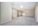 Open concept living room with neutral color palette and ample natural light at 1833 Hillcrest St, Tarpon Springs, FL 34689