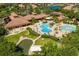 Aerial view of community pool, clubhouse, and green space at 205 Silver Falls Dr, Apollo Beach, FL 33572