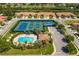 Community overview showing pool, tennis courts, and residential buildings at 205 Silver Falls Dr, Apollo Beach, FL 33572