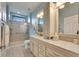 Spa-like bathroom with walk-in shower, double vanity, and updated fixtures at 205 Silver Falls Dr, Apollo Beach, FL 33572