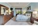 Main bedroom with plush carpet and private balcony access at 205 Silver Falls Dr, Apollo Beach, FL 33572