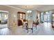Formal dining room features a charming table setting and hardwood floors at 205 Silver Falls Dr, Apollo Beach, FL 33572