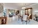 Elegant dining room features hardwood floors and a large window at 205 Silver Falls Dr, Apollo Beach, FL 33572