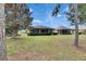 Home's exterior features a screened lanai and mature landscaping at 205 Silver Falls Dr, Apollo Beach, FL 33572