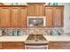 Kitchen boasts a stylish backsplash and modern appliances at 205 Silver Falls Dr, Apollo Beach, FL 33572