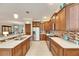 Modern kitchen with stainless steel appliances and wood cabinetry at 205 Silver Falls Dr, Apollo Beach, FL 33572