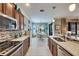 Open kitchen features breakfast nook, stainless steel appliances, and light tile floors at 205 Silver Falls Dr, Apollo Beach, FL 33572