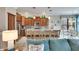 Open kitchen with breakfast bar, stainless steel appliances, and light cabinets at 205 Silver Falls Dr, Apollo Beach, FL 33572