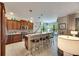 Island kitchen with breakfast bar, stainless steel appliances and wood cabinets at 205 Silver Falls Dr, Apollo Beach, FL 33572