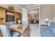 Home office with built-in shelving, desk and view into dining room at 205 Silver Falls Dr, Apollo Beach, FL 33572