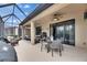 Relaxing screened patio with seating and dining areas at 205 Silver Falls Dr, Apollo Beach, FL 33572