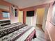 Second bedroom with a queen-size bed, dresser, and walk-in closet at 2067 Hunters Glen Dr # 313, Dunedin, FL 34698