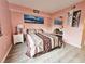 Cozy bedroom with a queen-size bed, a dresser, and a mirrored closet at 2067 Hunters Glen Dr # 313, Dunedin, FL 34698