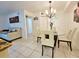 Dining area with glass table and four chairs at 2067 Hunters Glen Dr # 313, Dunedin, FL 34698