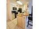 Kitchen with granite countertops and breakfast bar at 2067 Hunters Glen Dr # 313, Dunedin, FL 34698