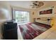 Bright living room with comfy sofa, large rug, and sliding glass door leading to a patio at 2067 Hunters Glen Dr # 313, Dunedin, FL 34698