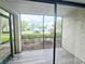 Private screened porch with tiled floor, offering a peaceful outdoor space at 2067 Hunters Glen Dr # 313, Dunedin, FL 34698