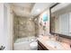Updated bathroom with tub, shower, and granite vanity at 2406 Gulf Blvd # 204, Indian Rocks Beach, FL 33785