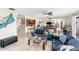 Bright living room with comfy seating and ocean views at 2406 Gulf Blvd # 204, Indian Rocks Beach, FL 33785