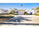 Single story home with a large front yard at 256 145Th E Ave, Madeira Beach, FL 33708